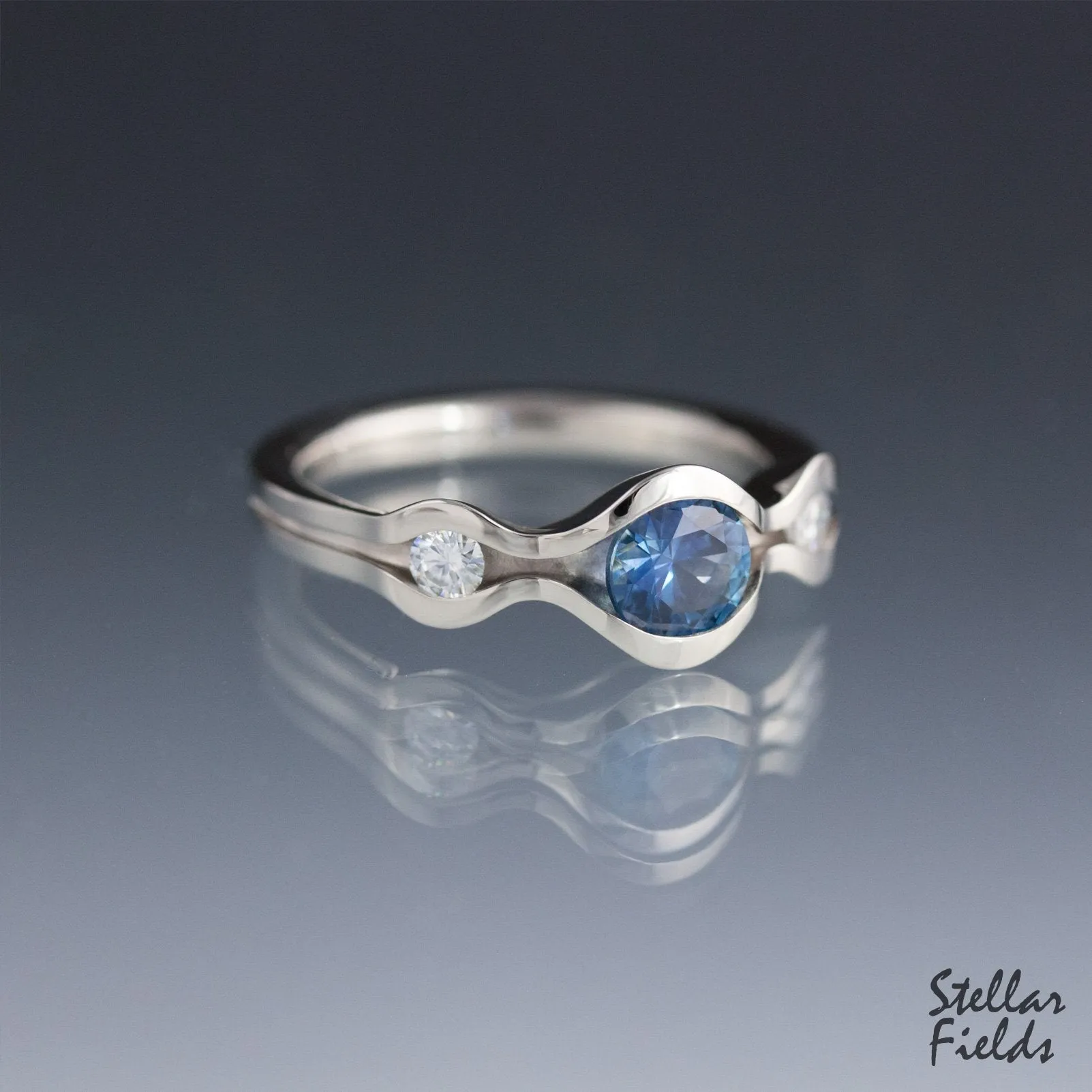 Three Stone Wave Engagement Ring with Blue Montana Sapphire & Canadian Arctic Diamonds