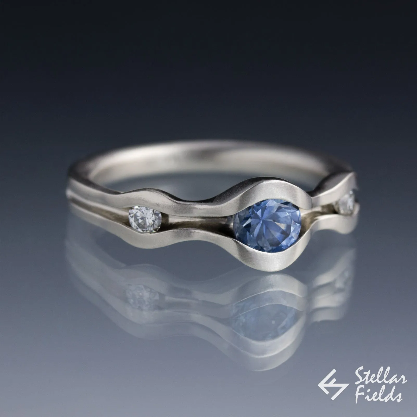 Three Stone Wave Engagement Ring with Blue Montana Sapphire & Canadian Arctic Diamonds