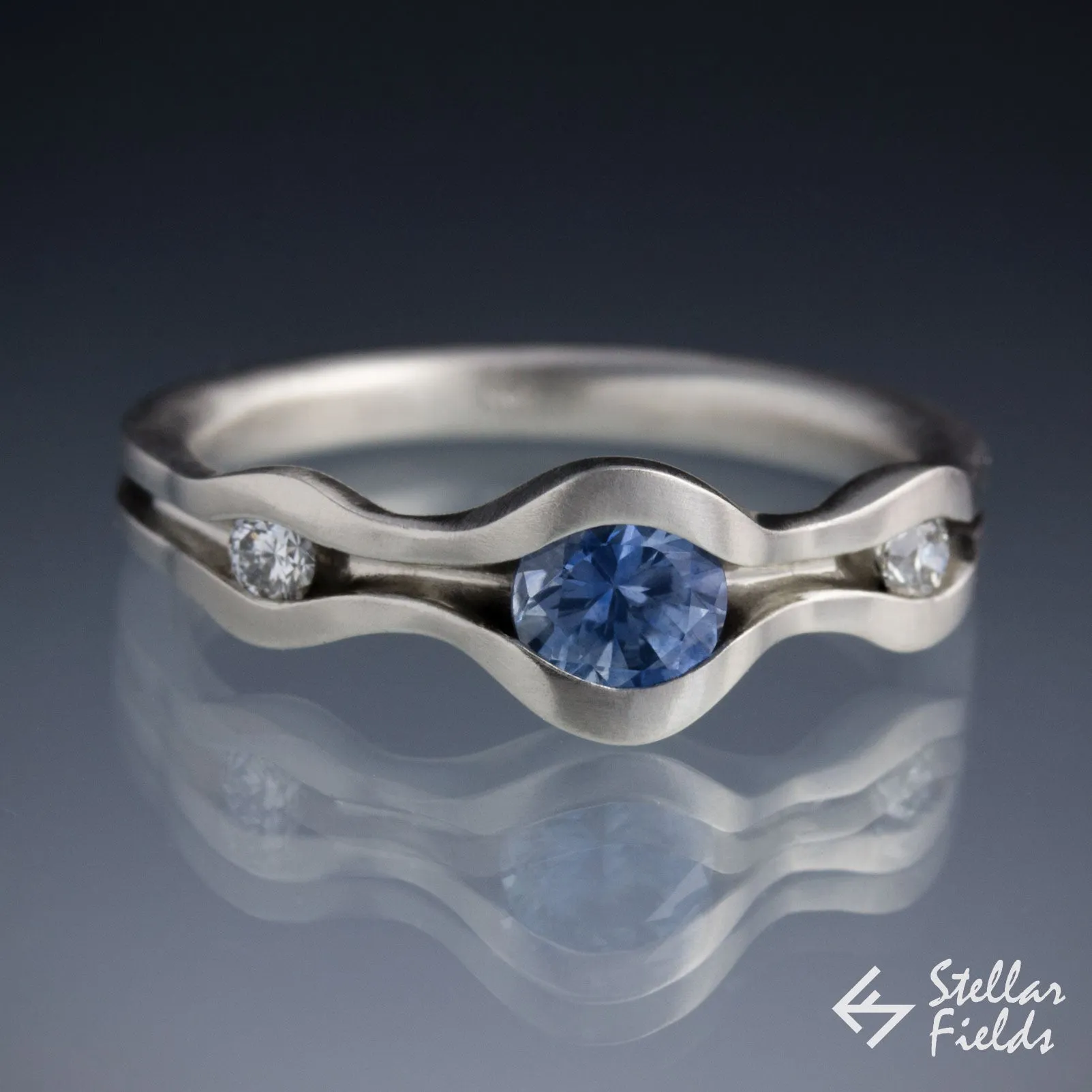 Three Stone Wave Engagement Ring with Blue Montana Sapphire & Canadian Arctic Diamonds