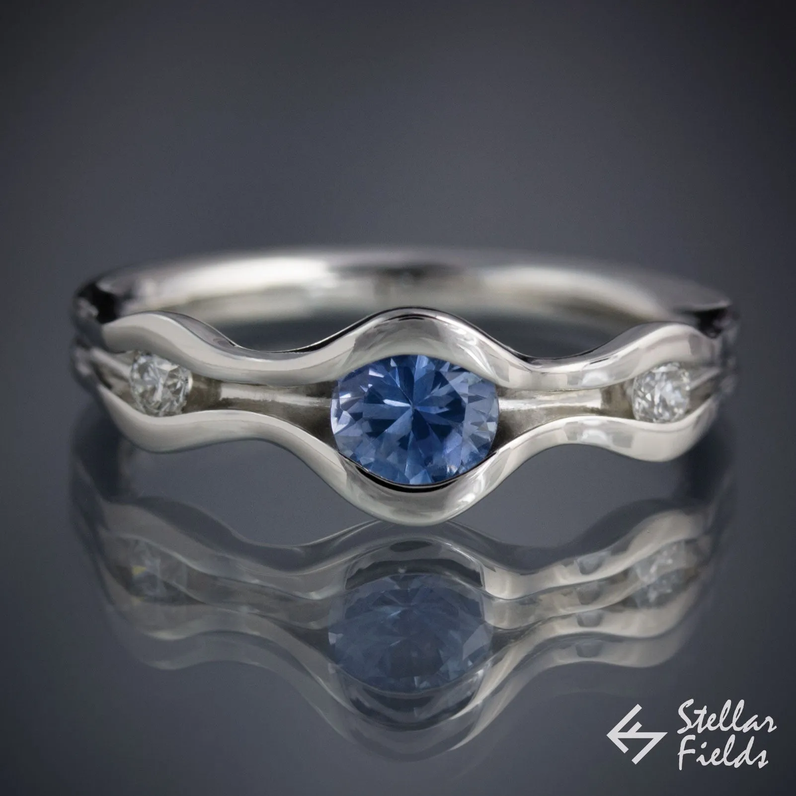 Three Stone Wave Engagement Ring with Blue Montana Sapphire & Canadian Arctic Diamonds